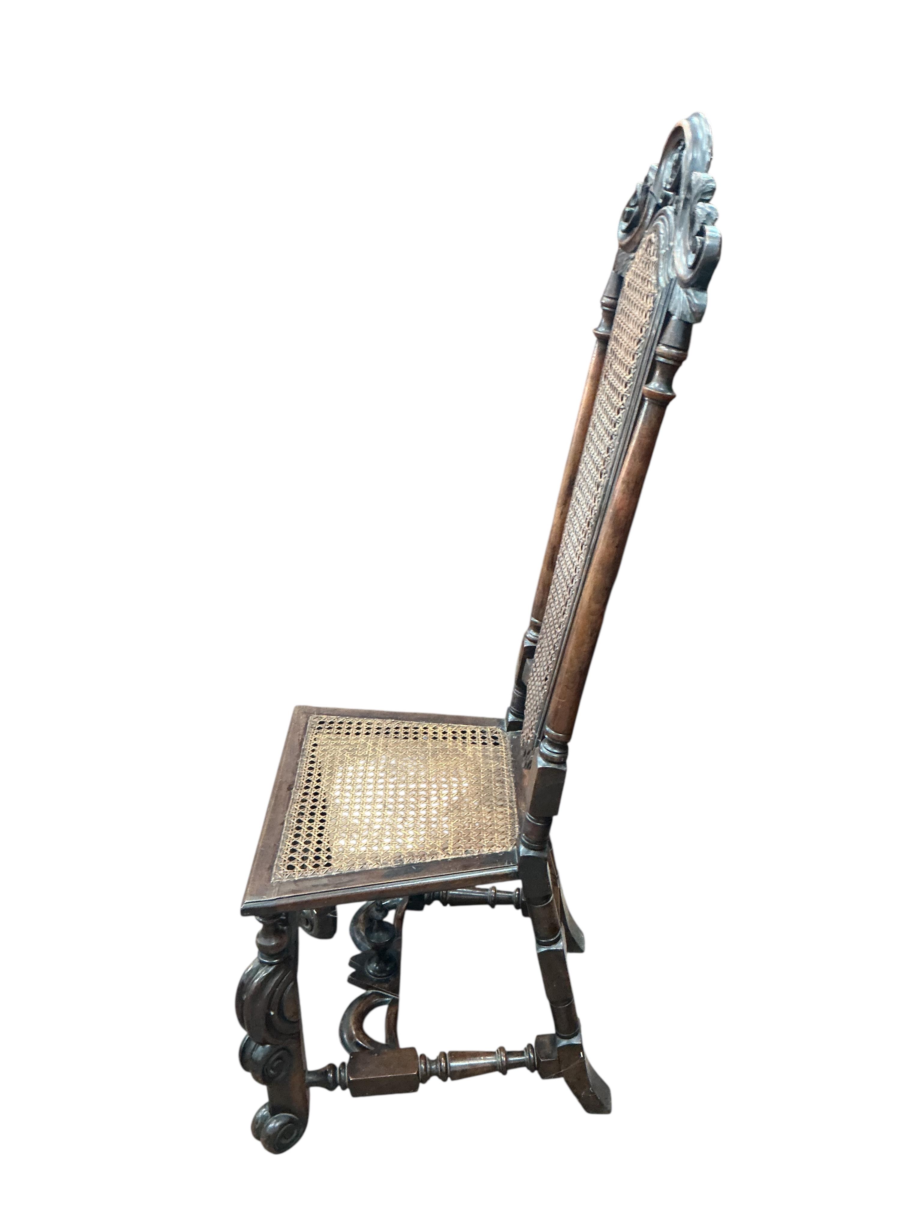 A pair of William and Mary walnut and cane work side chairs, width 46cm, depth 48cm, height 116cm